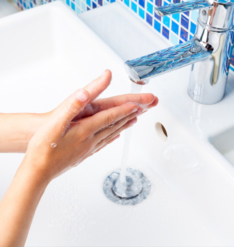 Washing-hands-blue-tiles